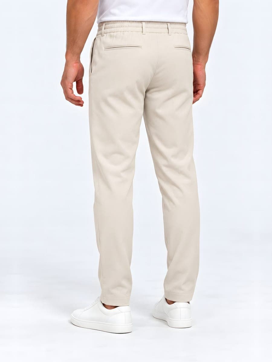 Tapered drawstring trousers in beige, back view