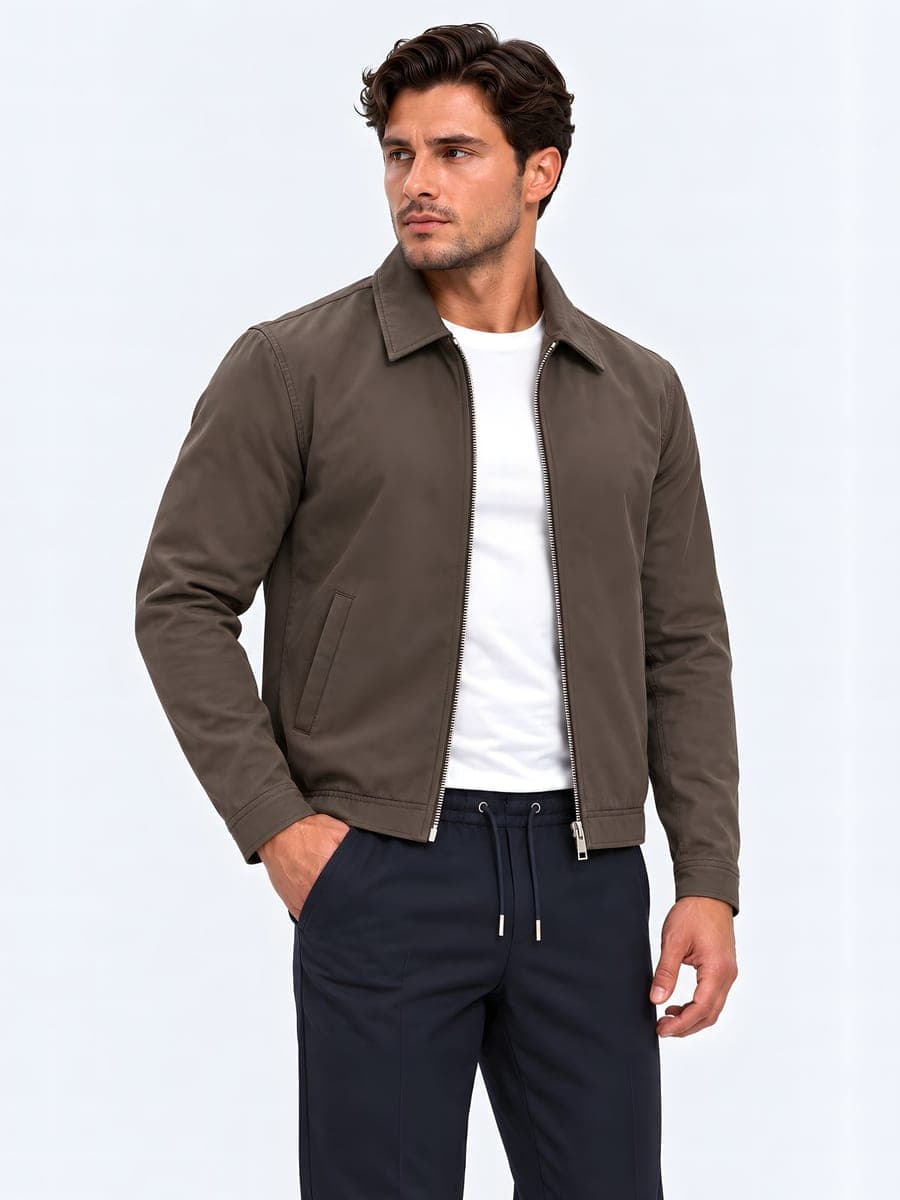 Lightly lined jacket with a lapel collar in brown, worn with a hand in the pocket