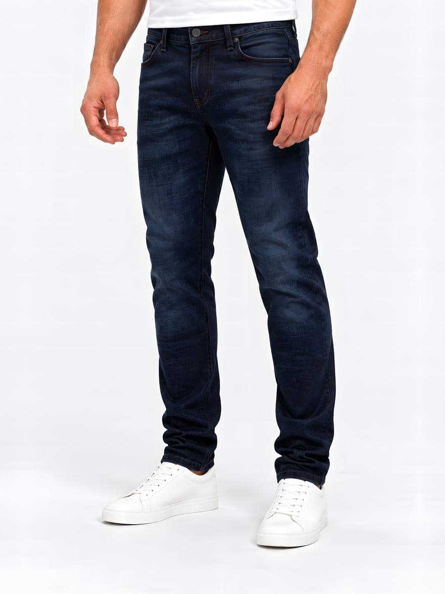 Slim fit jeans in dark blue, angled front view