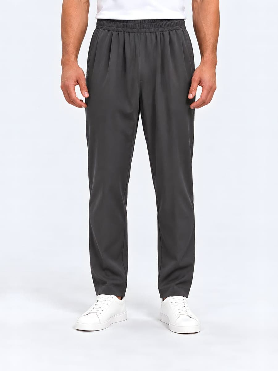 Straight leg trousers with an elastic waist in dark grey, front view