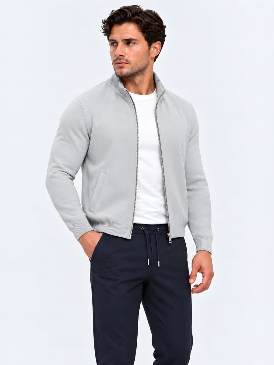 Heavy cotton zip cardigan in grey, worn with a hand in the pocket