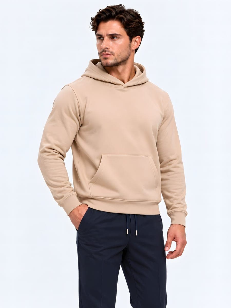 Heavyweight hoodie, regular fit in light brown / sand, worn with a hand in the pocket