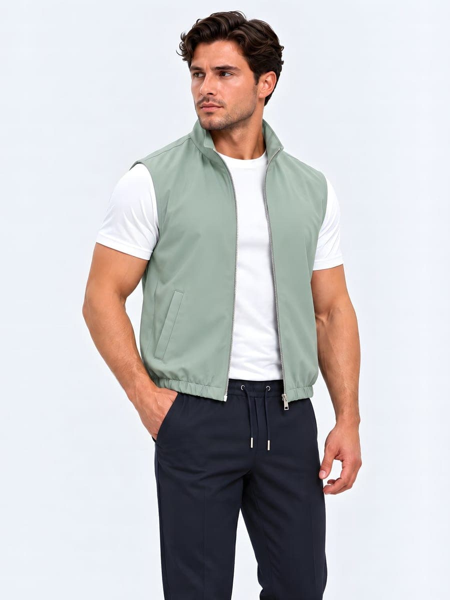 Reversible bodywarmer in mint green, worn with a hand in the pocket