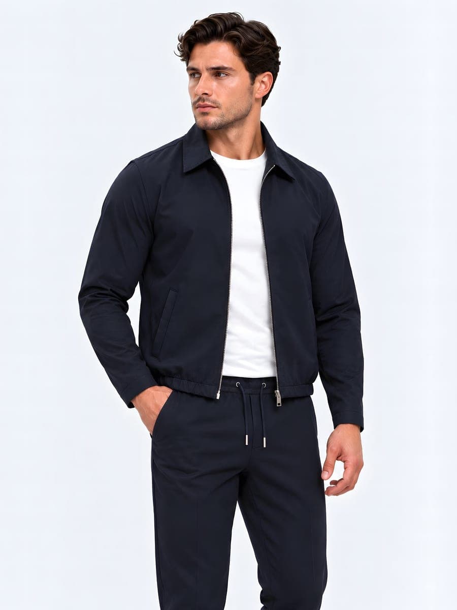 Light jacket with collar and elastic hem in navy, worn with a hand in the pocket
