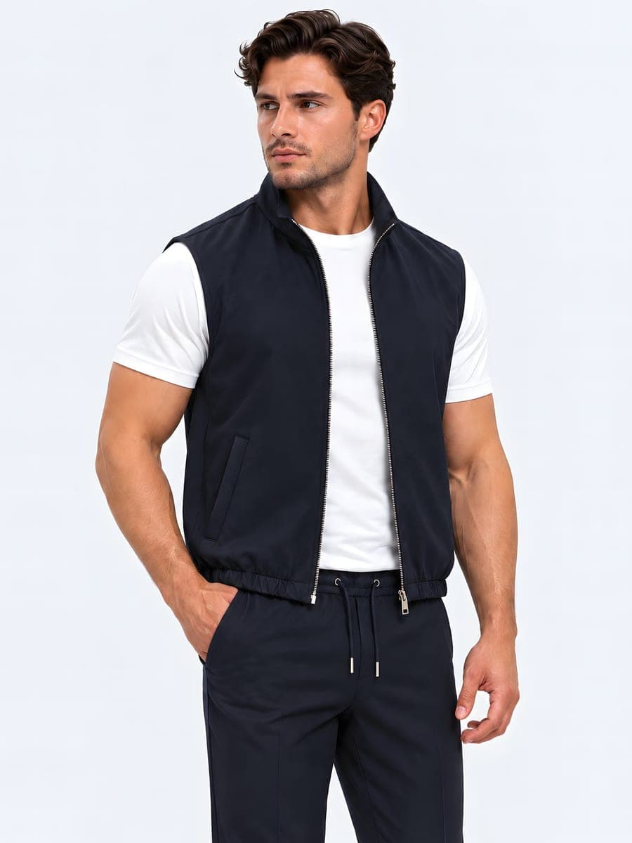 Polyester bodywarmer with a two-way zip in navy, worn with a hand in the pocket