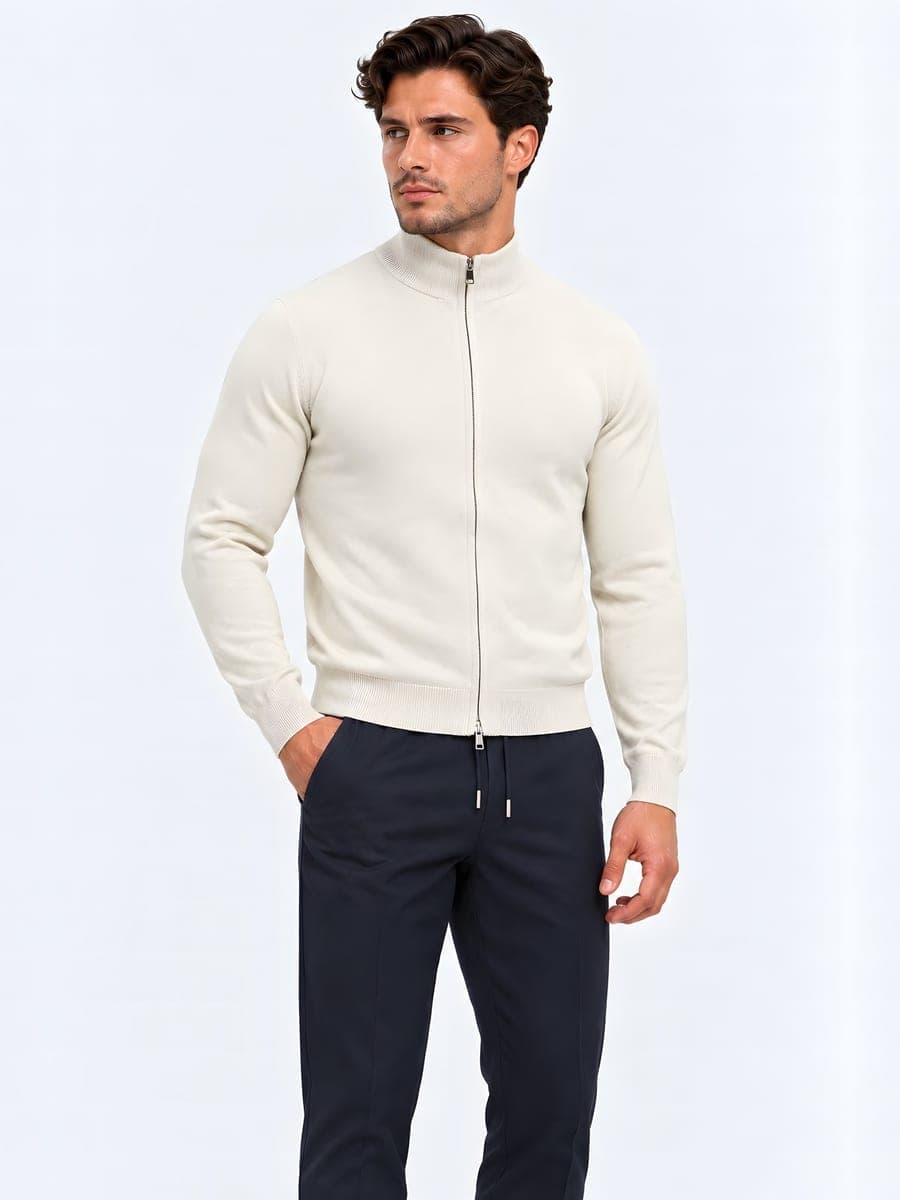 Fitted knitted zip cardigan in sand, worn with a hand in the pocket