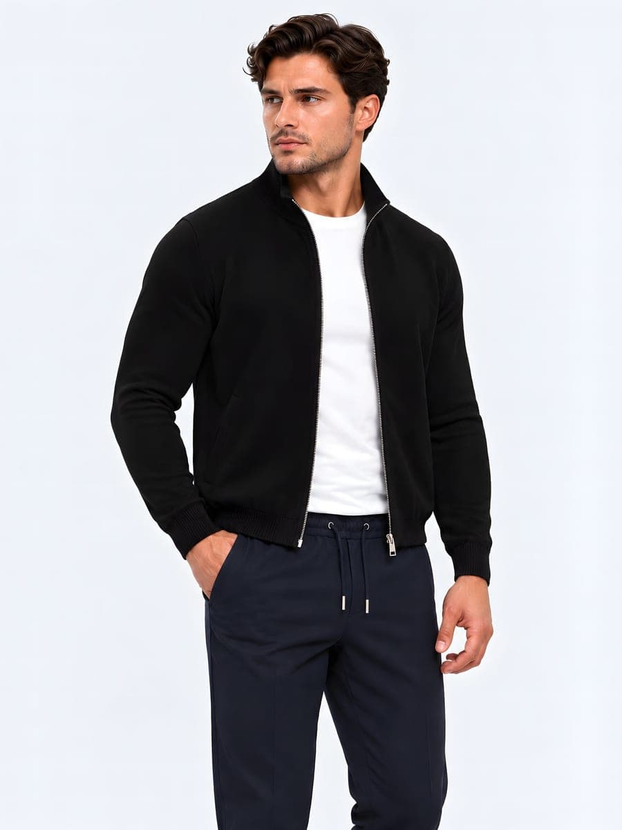 Fitted knitted zip cardigan in black, worn with a hand in the pocket