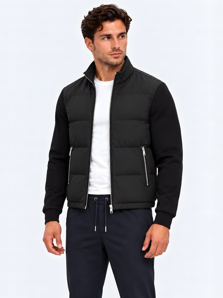 Jacket with a padded body and sweat sleeves in black, angled front view