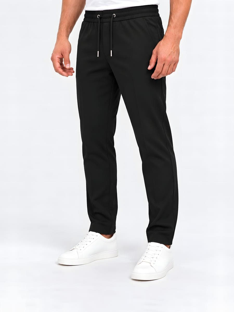 Polyester straight leg drawstring trousers in black, angled front view