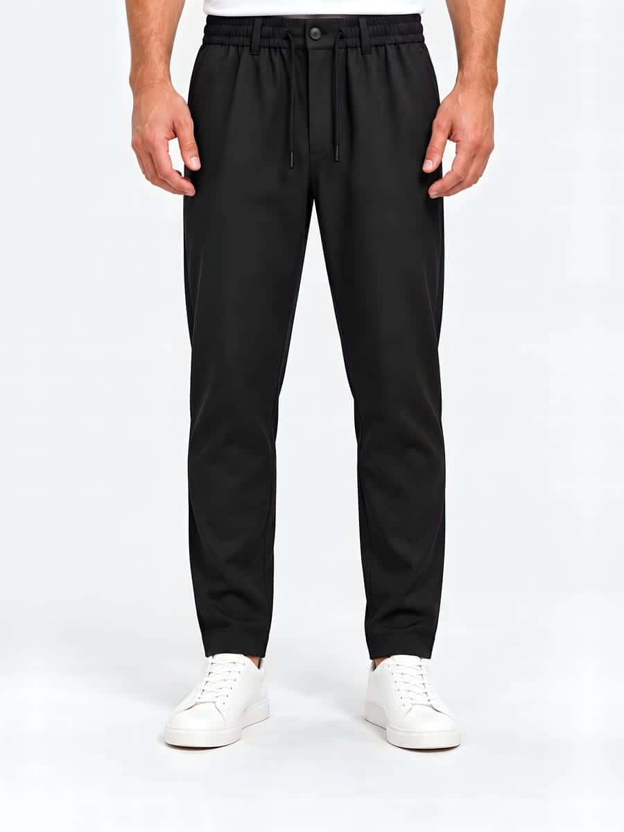 Tapered drawstring trousers in black, front view