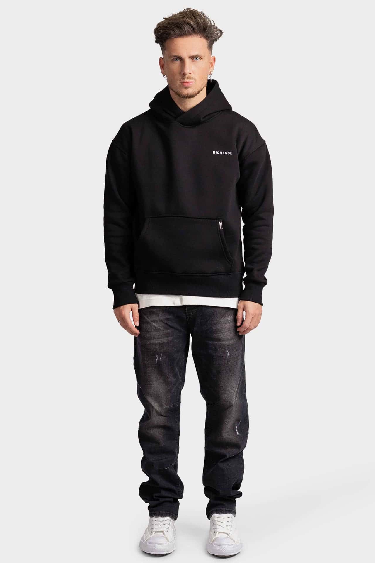 Black hoodie with a small logo on the front